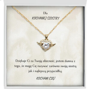 Zbliżenie na złoty naszyjnik serce ze skrzydłami - prezent dla siostry od siostry